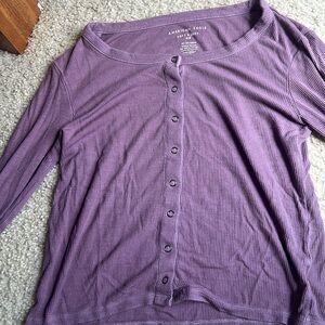 This is an American eagle shirt that is purple and a size xs